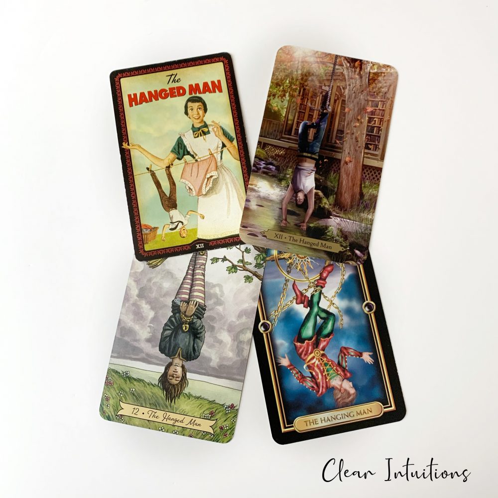 Tarot by Comparison™ - The Hanged Man Tarot Card Meaning 2 The Hanged Man Tarot Card - The Housewives Tarot, Wizards Tarot, Gilded Tarot, Crystal Visions Tarot